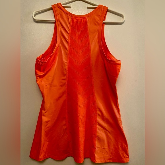 Under Armor heat gear fitted tank top
color: neon orange size large - Picture 2 of 3